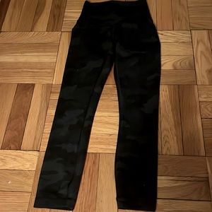 These are lululemon wonder train high rise leggings. The color is camo.